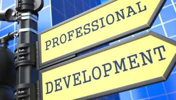 Business Concept. Professional Development Sign on Blue Background.