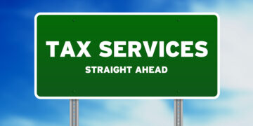 High resolution graphic of a tax services highway sign on Cloud Background.